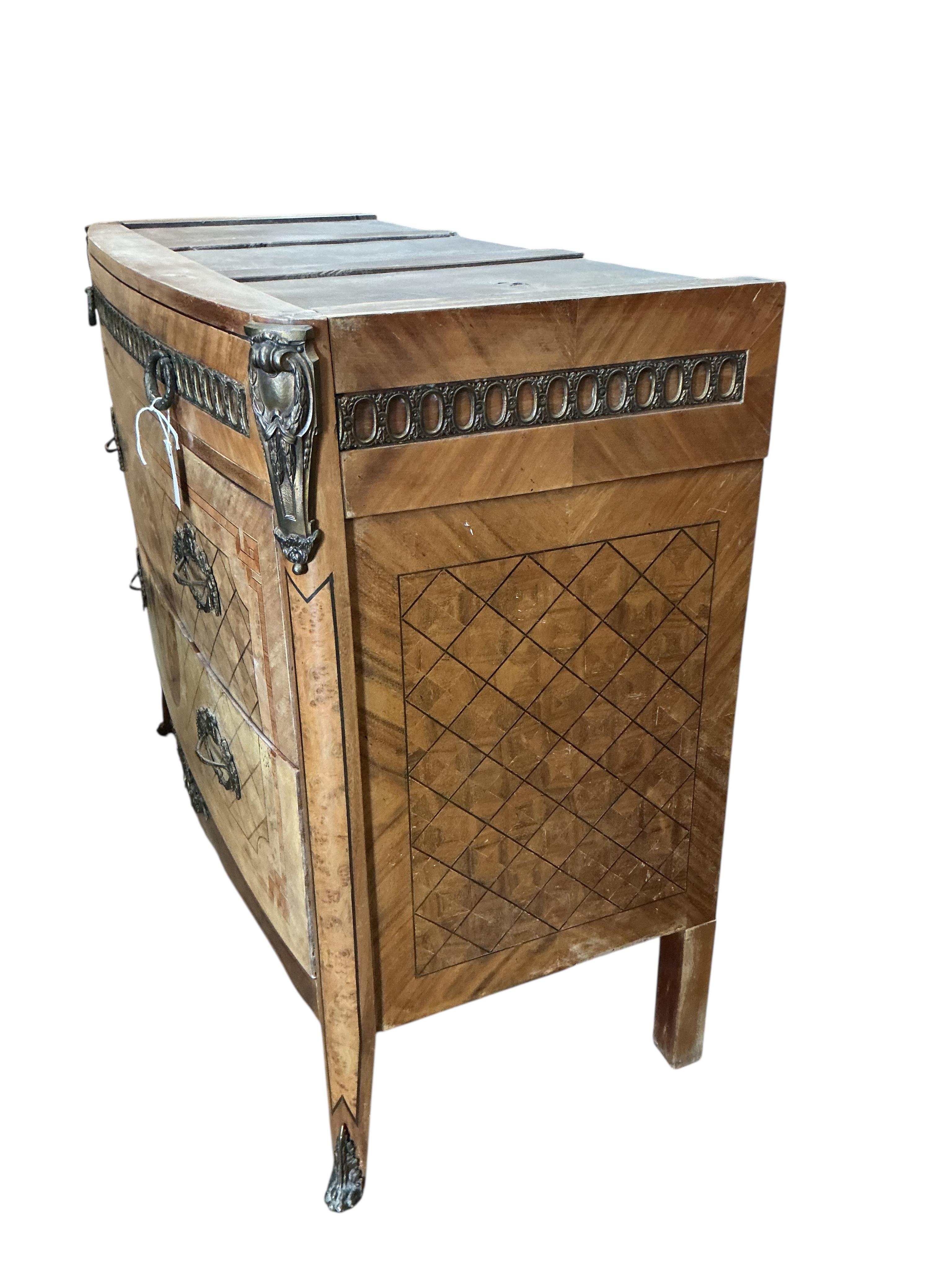 A Louis XVI style marquetry inlaid mahogany commode, lacking marble top, width 122cm, depth 53cm, height 100cm